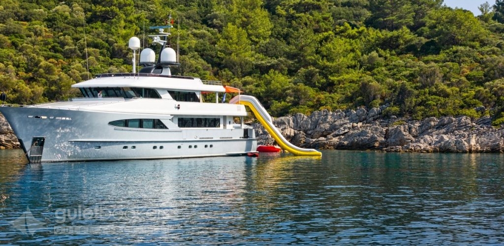 A luxury white motor yacht in the bay