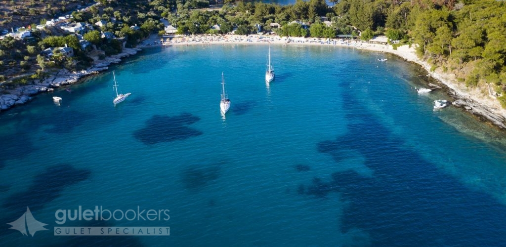 Sail Boats In Turquoise Water In Thassos Greece