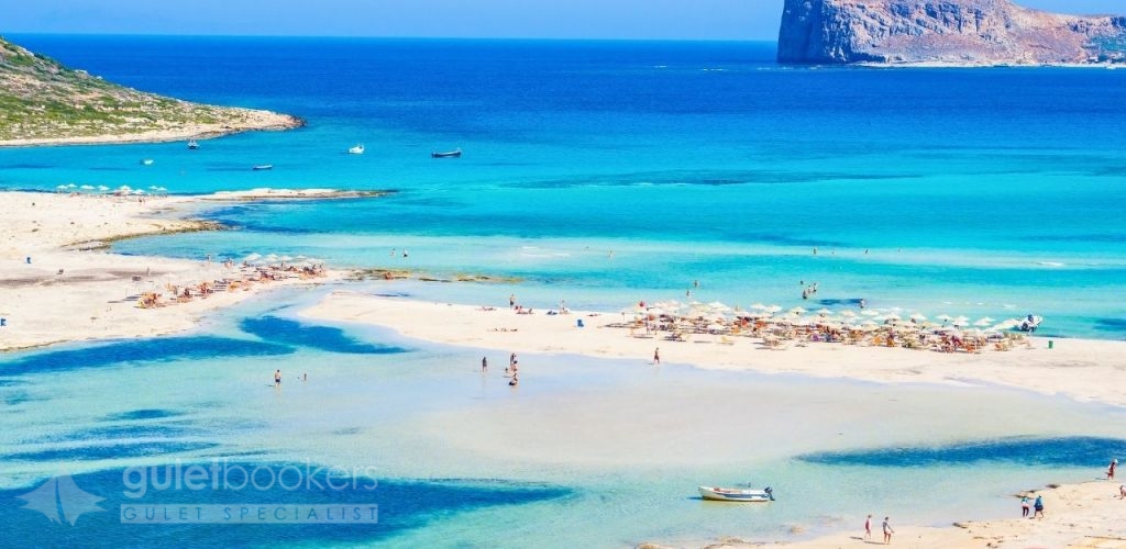 Your traditional gulet yacht can cruise along the island's varied coastline, from the palm-fringed beaches of Vai in the east to the dramatic gorges of the south.